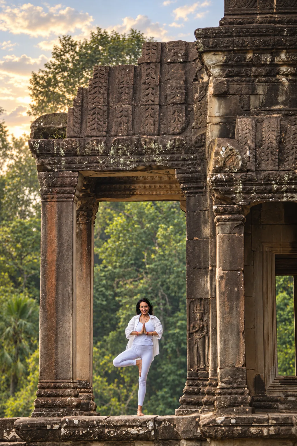 Marielisa Padilla in tree pose framed by a temple doorway at Angkor